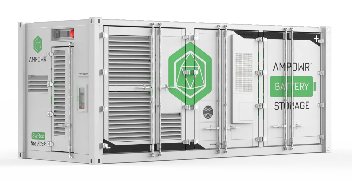 Outdoor utility-scale battery installation in a solar farm, surrounded by panels and open sky. 3:2 aspect ratio.
