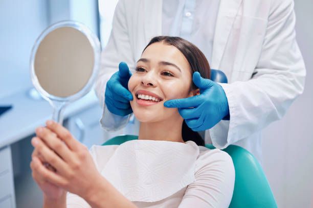 Dental patient looking in mirror