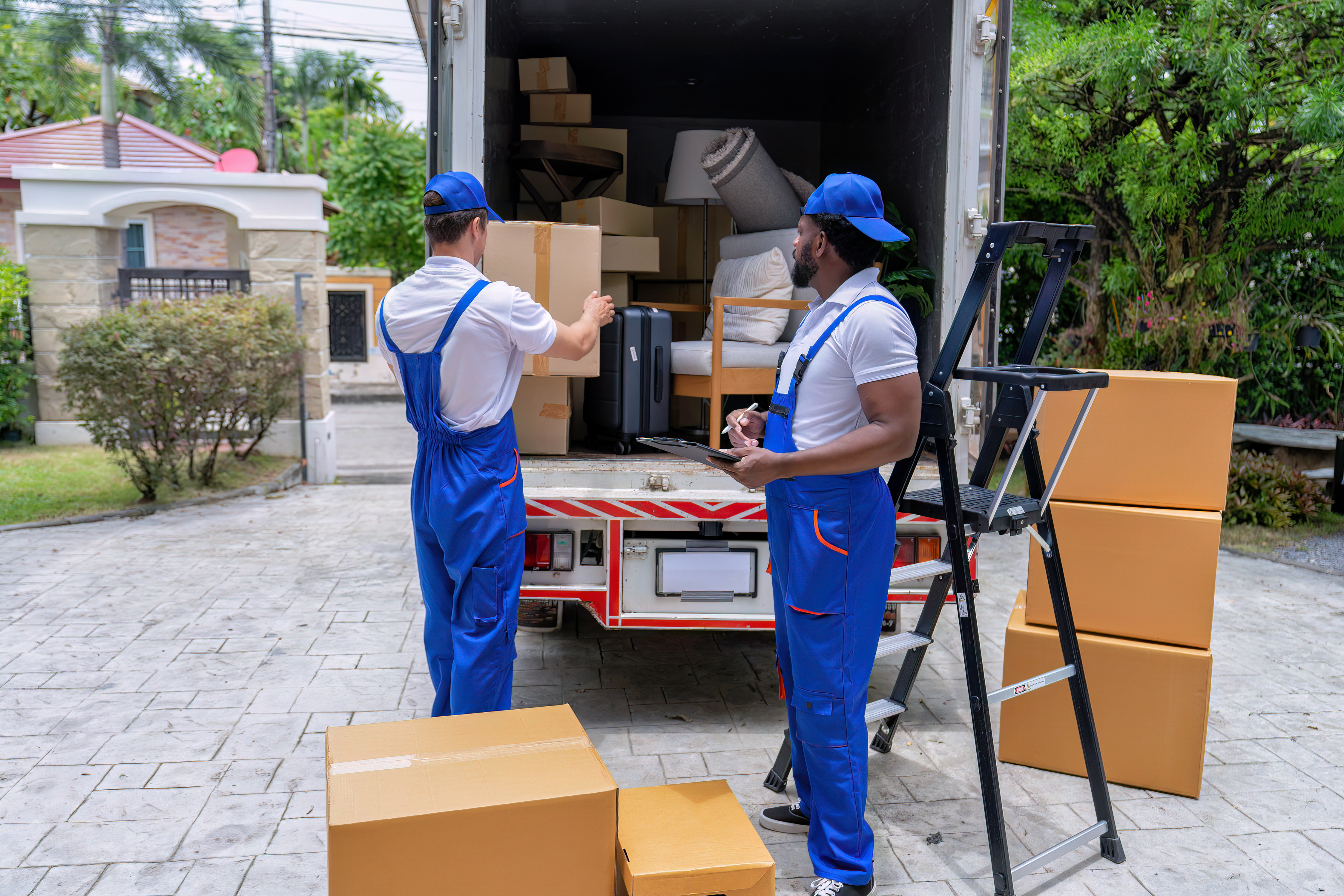 Several individually wrapped condoms on a gray surface.