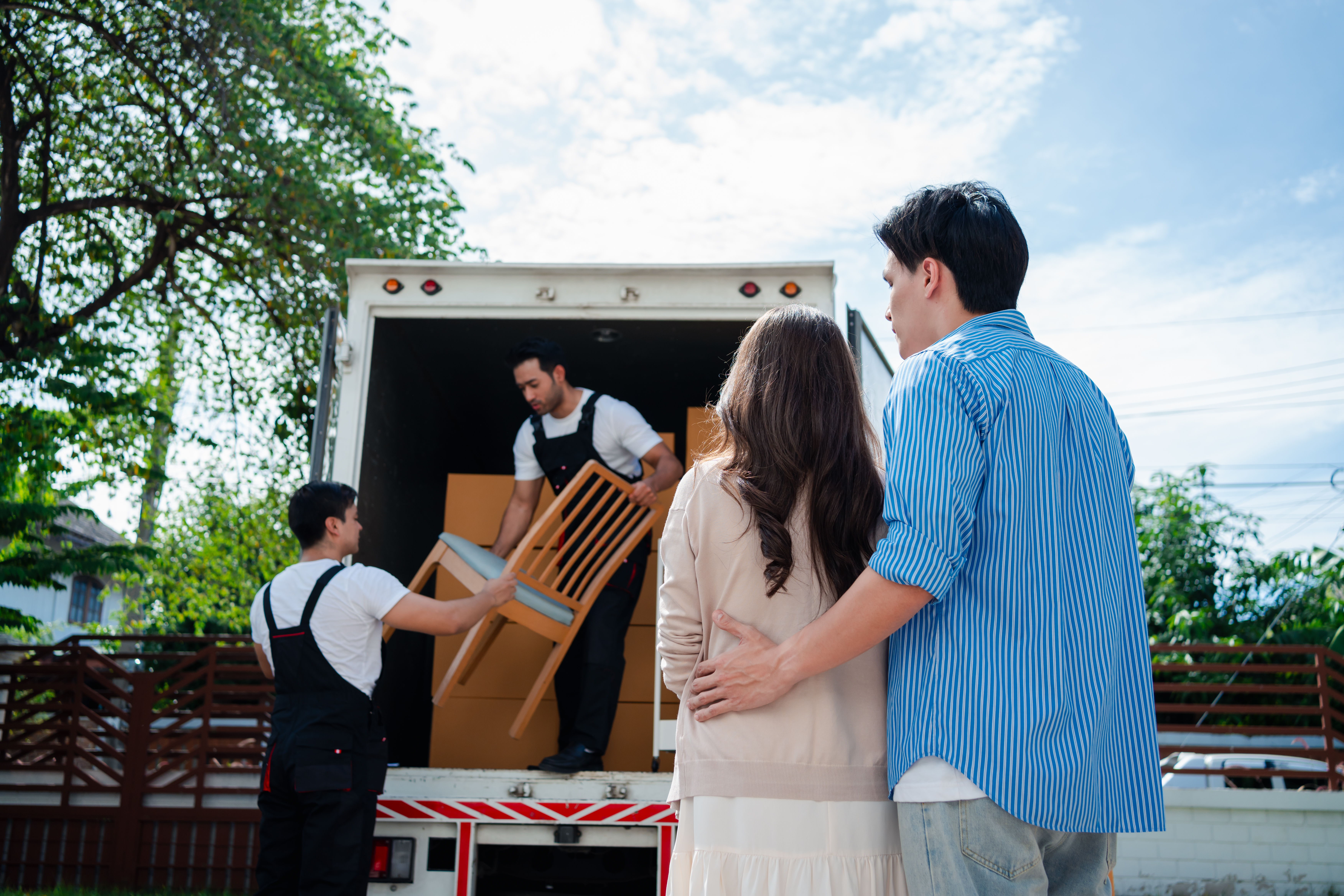 a moving sign is taped to a pole