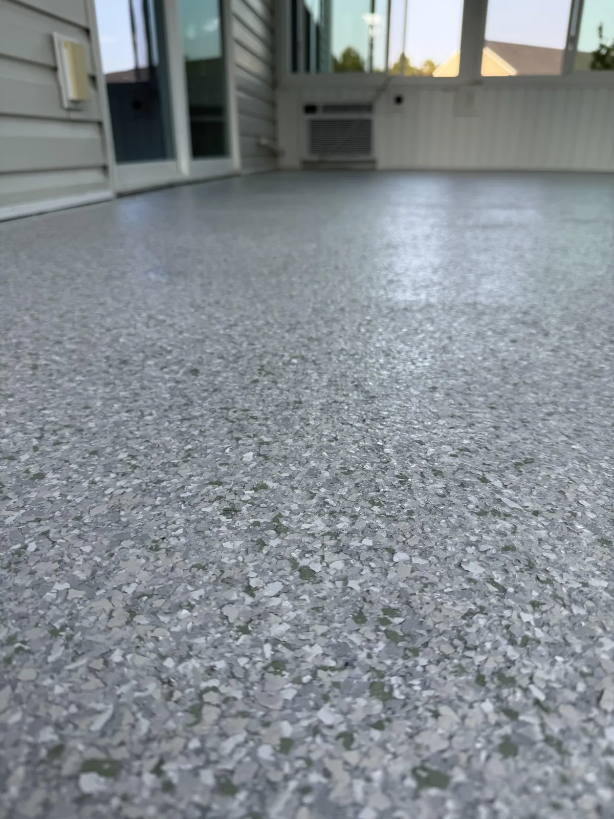 Finished epoxy garage floor coating in a Rincon, GA home with metallic flake finish