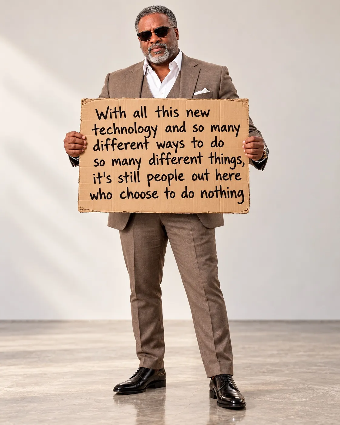 Robert Smith holding a sign at an event