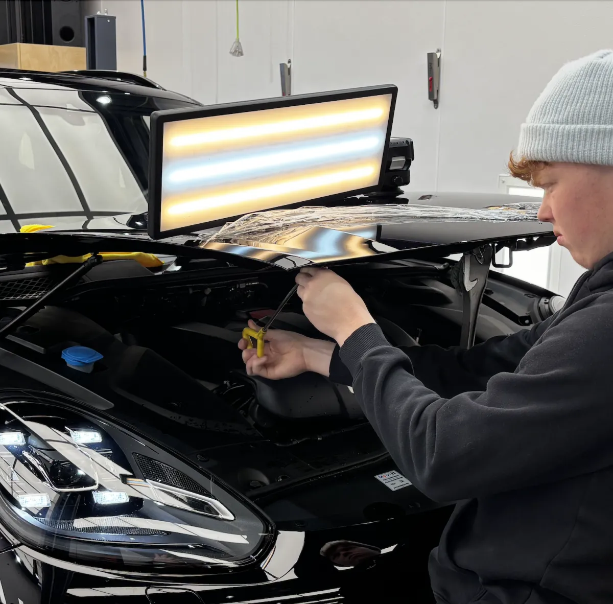 Paintless dent repair performed in-shop at Apex Auto Works in Canmore, Alberta