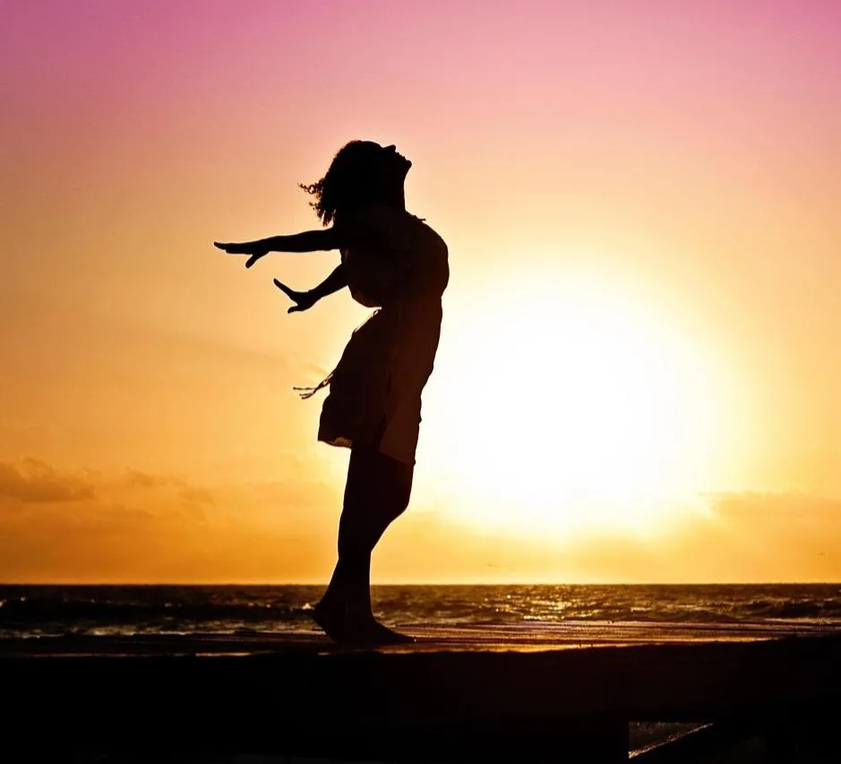 Joyful figure stepping into abundance