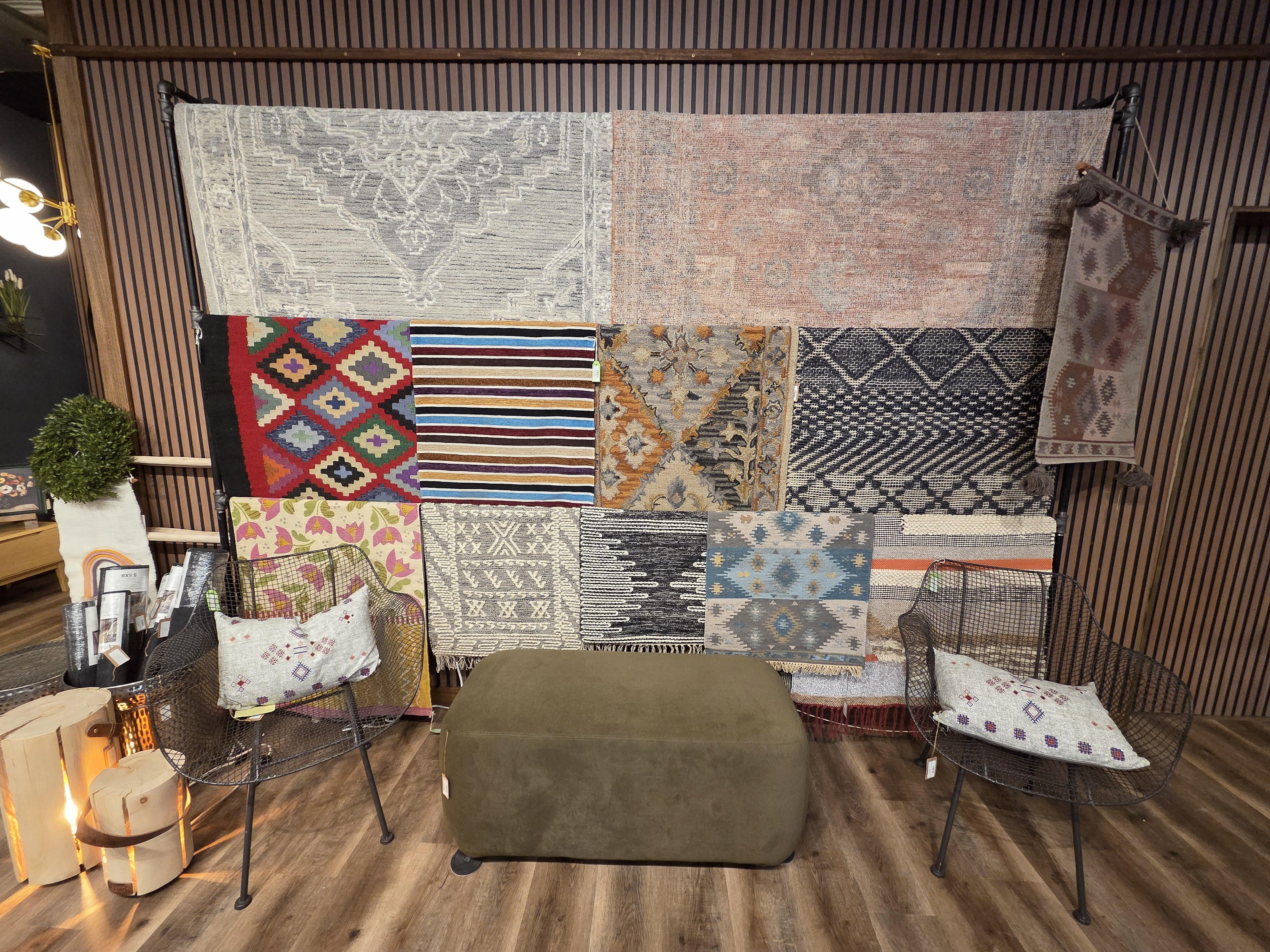 Detailed product shot: plush sofa and oak side table staged with layered textiles and warm light, shallow depth of field, editorial photographic style to highlight texture and craftsmanship.