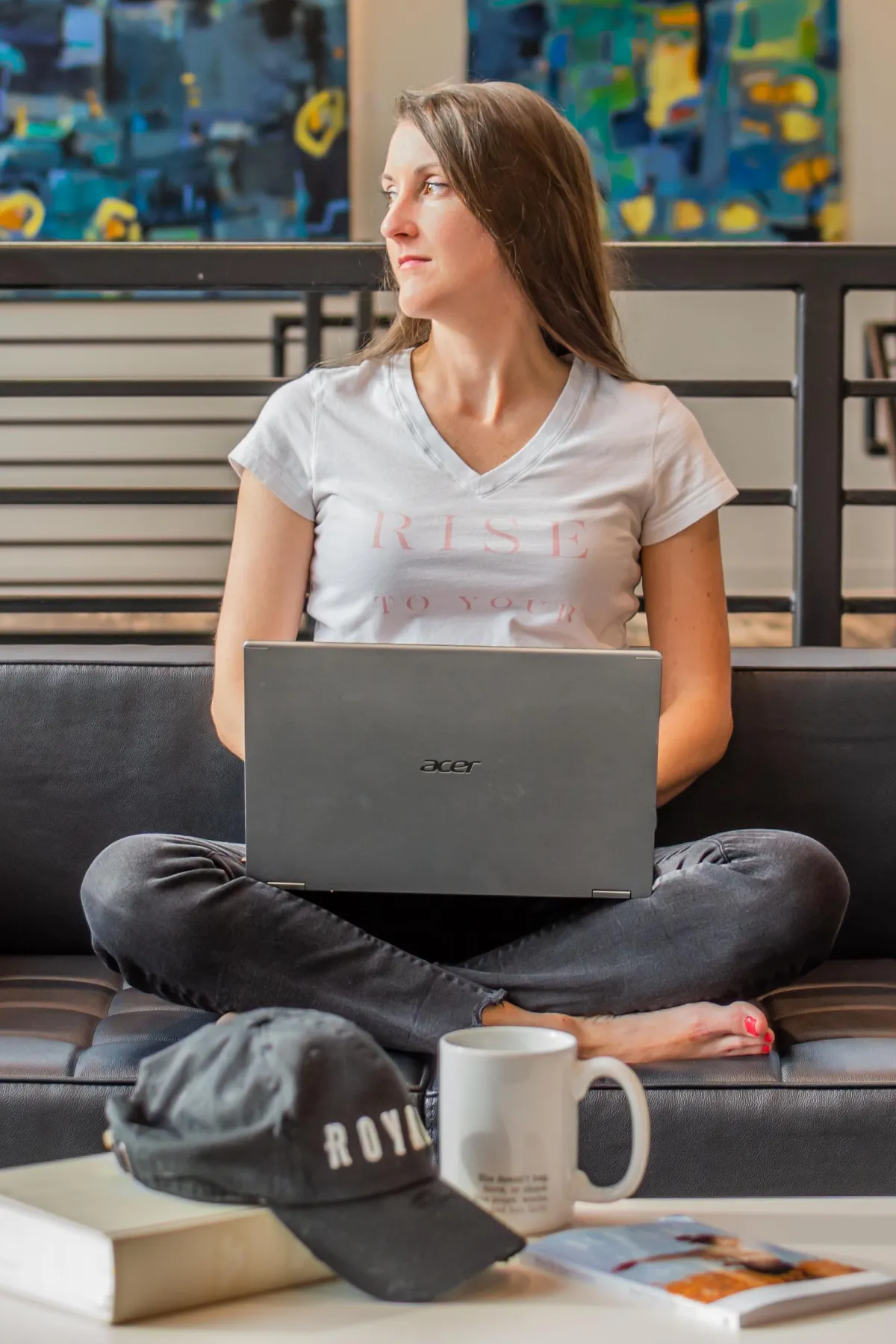 image of brandie thomas with a laptop looking away