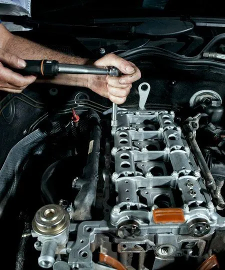 auto engine with open hood in deals tires shop