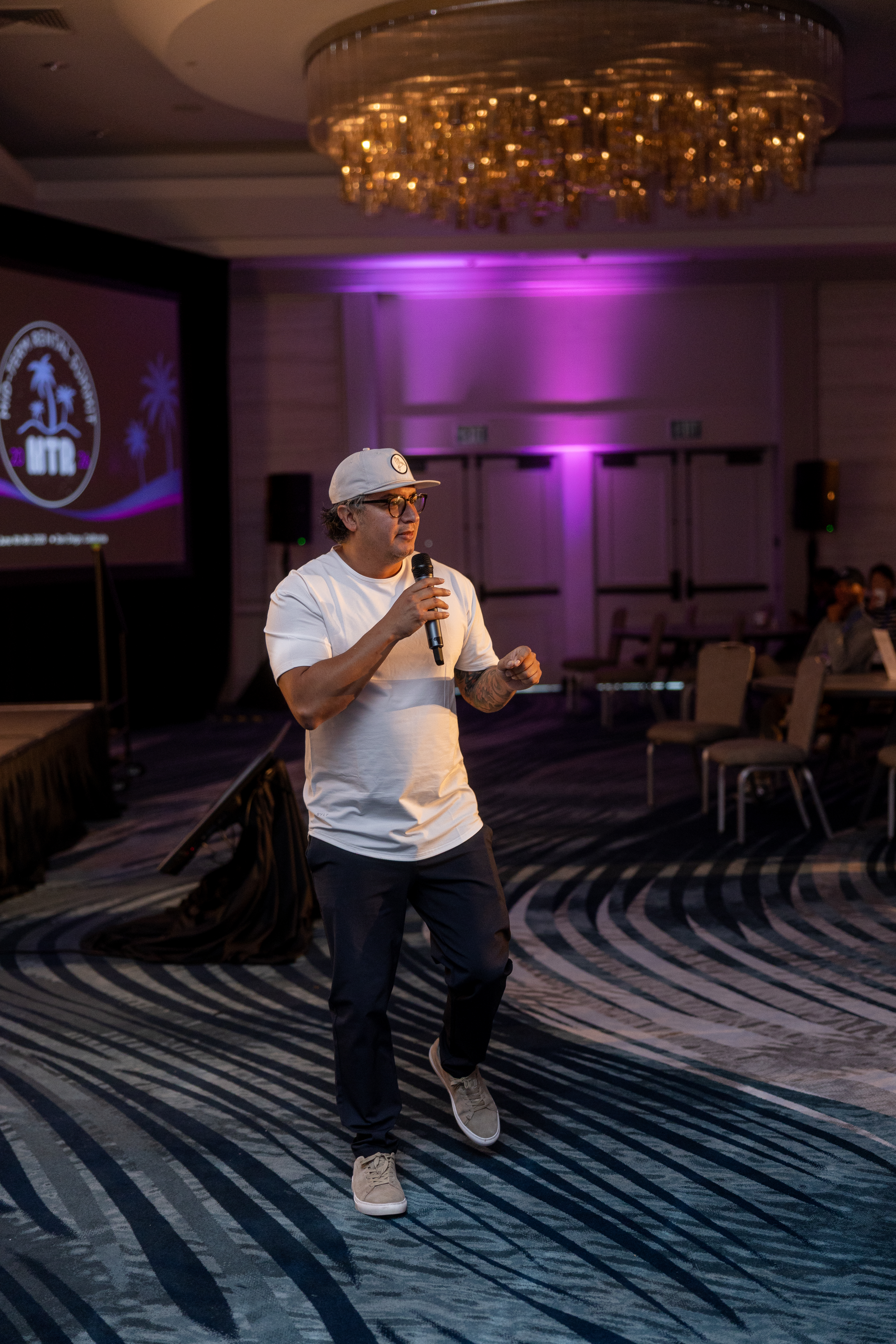 Jesse Vasquez on stage at Mid-Term Rental Summit.