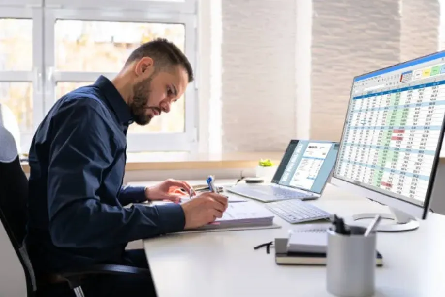 accountant reviewing tax data on computer
