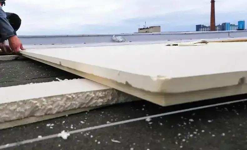 commercial roofing materials being applied to roof