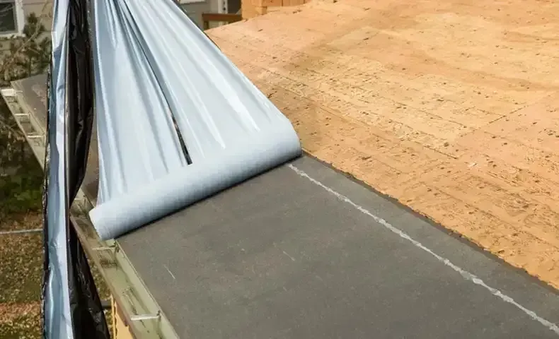 ice and water shield being applied to roof