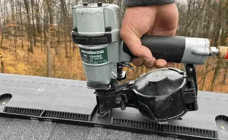 ridge vent being applied by nail gun