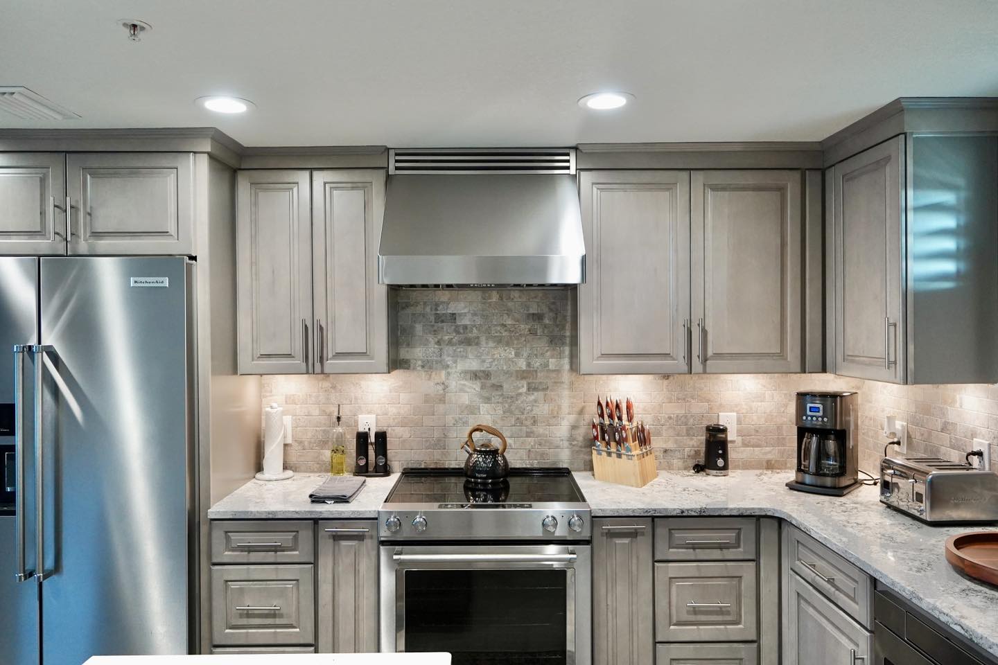 gray-shaker-cabinets-stone-backsplash-30a-kitchen-design