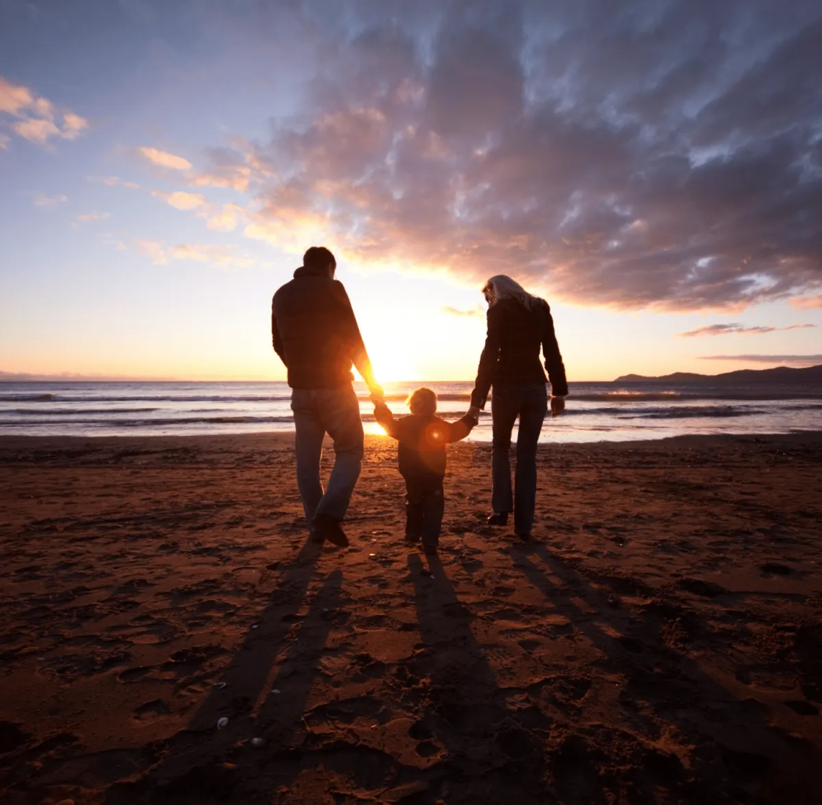 Family walking on the beach
