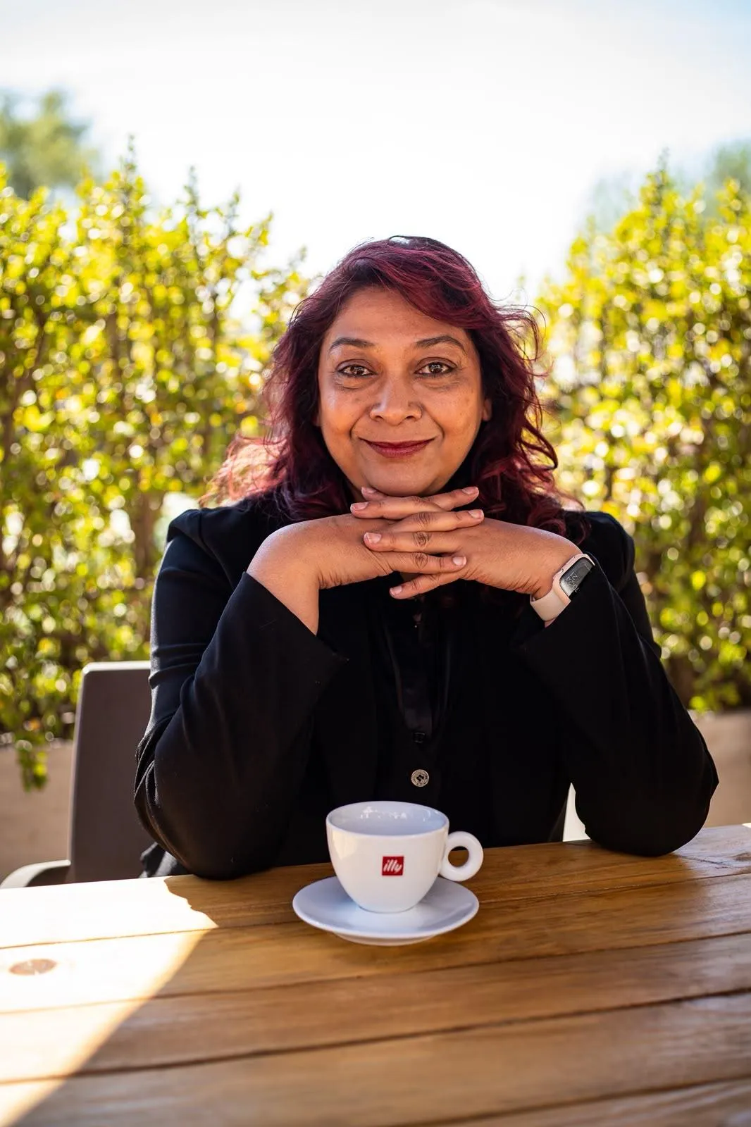 EmpowerHerHub Founder portrait in a warm film look