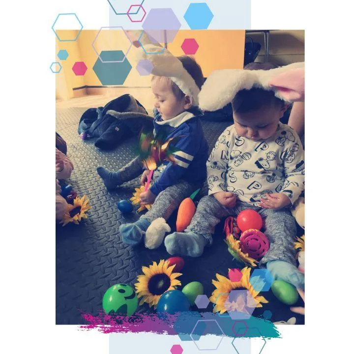 Two babies with bunny ears on sitting amongst toys at a CubCare Wrigglers Baby Yoga and sensory class in Welwyn Hatfield