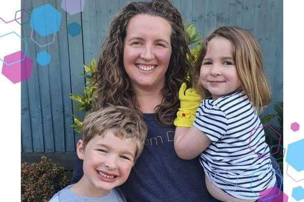 Jilly Clarke, antenatal teacher with CubCare, formally The Daisy Foundation Welwyn Hatfield. She is stood with her two children all smiling at the camera.