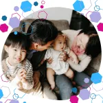 Multigenerational Asian family bonding at home, showing modern grandparents supporting baby care and parenting.