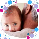 Baby resting on grandparent’s shoulder, capturing early bonding, emotional connection and intergenerational support.