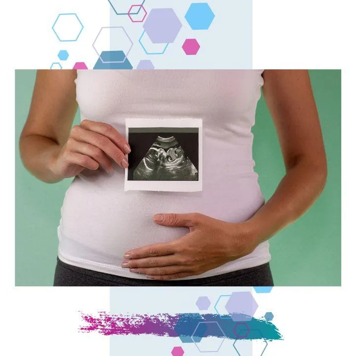 Pregnant person holding a first trimester ultrasound scan over their belly — representing early pregnancy, baby’s first scan, and antenatal care.