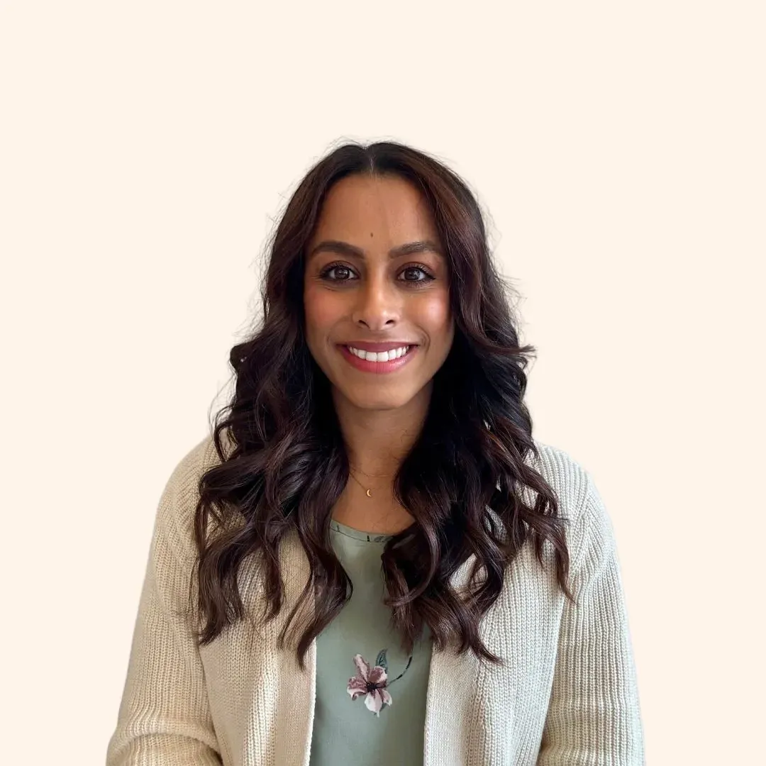 Darshana Patel, therapist and founder of Clear Moon Therapy, smiling warmlly