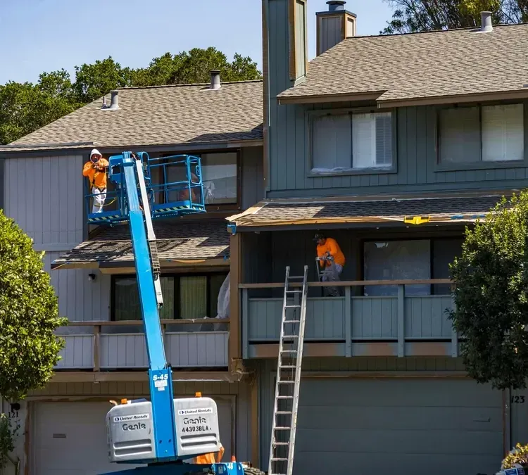 Crew installing fiber cement siding on a residential home in Palm Harbor, FL