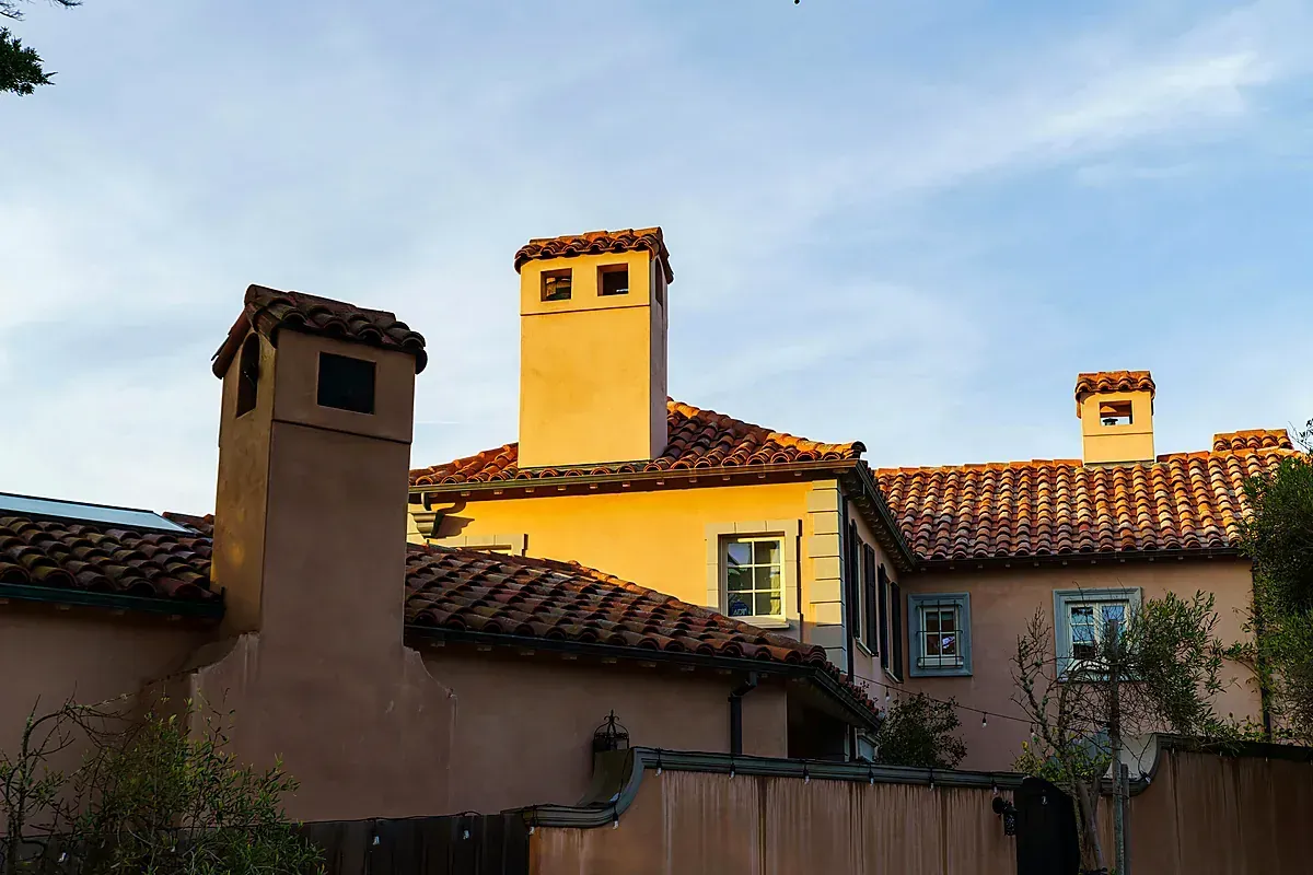 Mediterranean-style home with terracotta tile roof