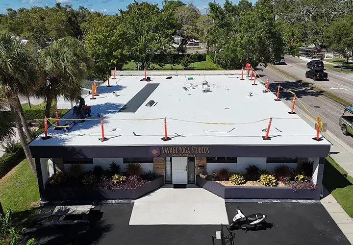 Commercial low-slope TPO flat & white membrane roof installation by Team Armored