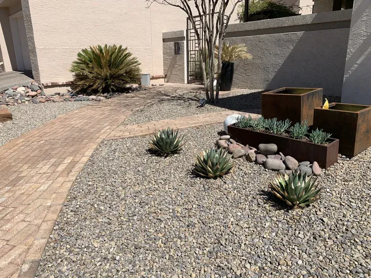  specialize in professional xeriscaping in Austin and Round Rock, TX, creating beautiful, low-maintenance landscapes that conserve water and thrive in the Texas climate. Our xeriscape designs use native plants, drought-tolerant grasses, decorative rock, mulch, and efficient drip irrigation to deliver stunning outdoor spaces that require minimal upkeep. Whether you want a modern desert-style front yard in Austin with cacti and stone pathways, or a Round Rock backyard xeriscape with gravel beds, succulents, and accent lighting, our team customizes each project to match your property and lifestyle. Xeriscaping not only reduces water bills but also increases curb appeal and sustainability, making it the perfect choice for homeowners looking to balance beauty with efficiency. Get your free estimate today and discover how xeriscaping in Austin or Round Rock can transform your yard into a water-wise landscape that lasts year-round.