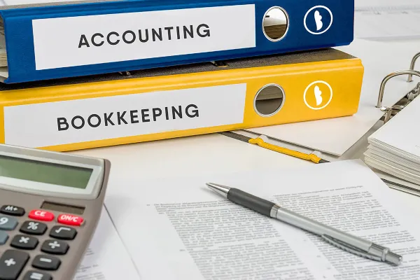 white and black camera on tripod