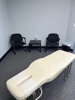 Chiropractic adjusting table in Tulsa clinic providing a clean and comfortable space for patient care