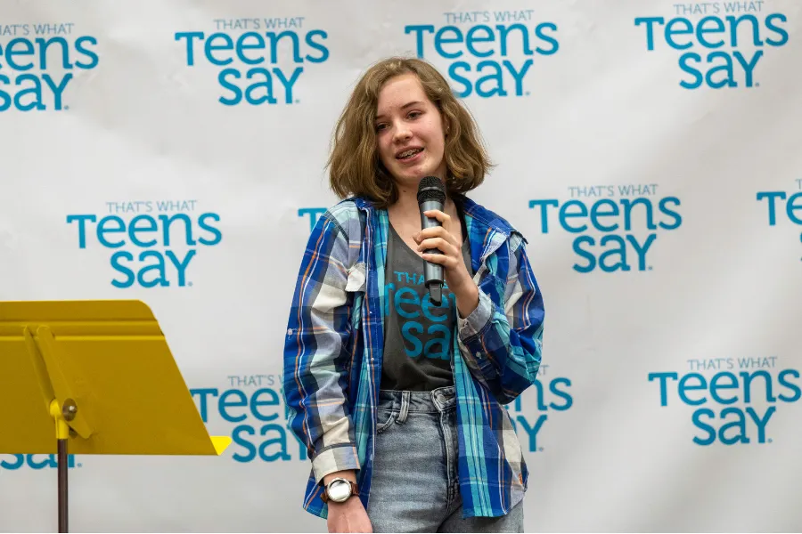 Teen telling story on stage