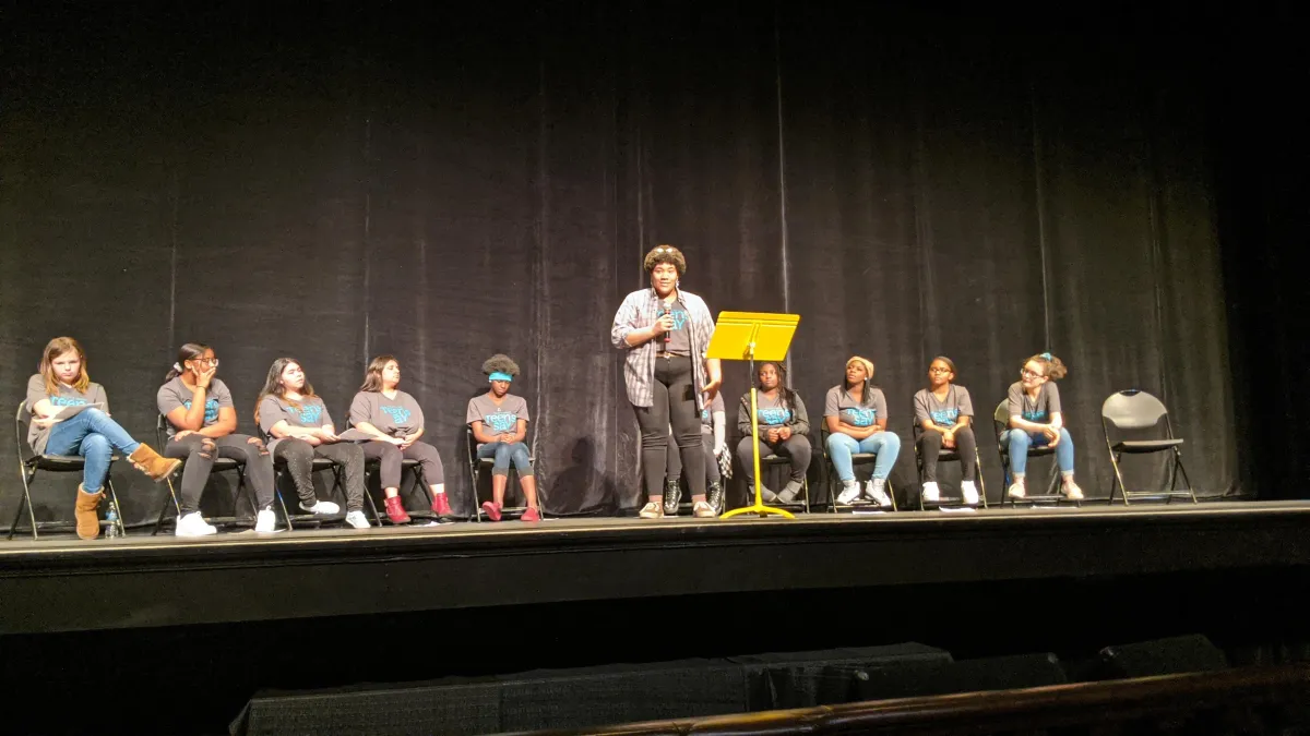 Teen telling story on stage
