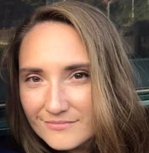 Color photo of white female with brown eyes and hair
