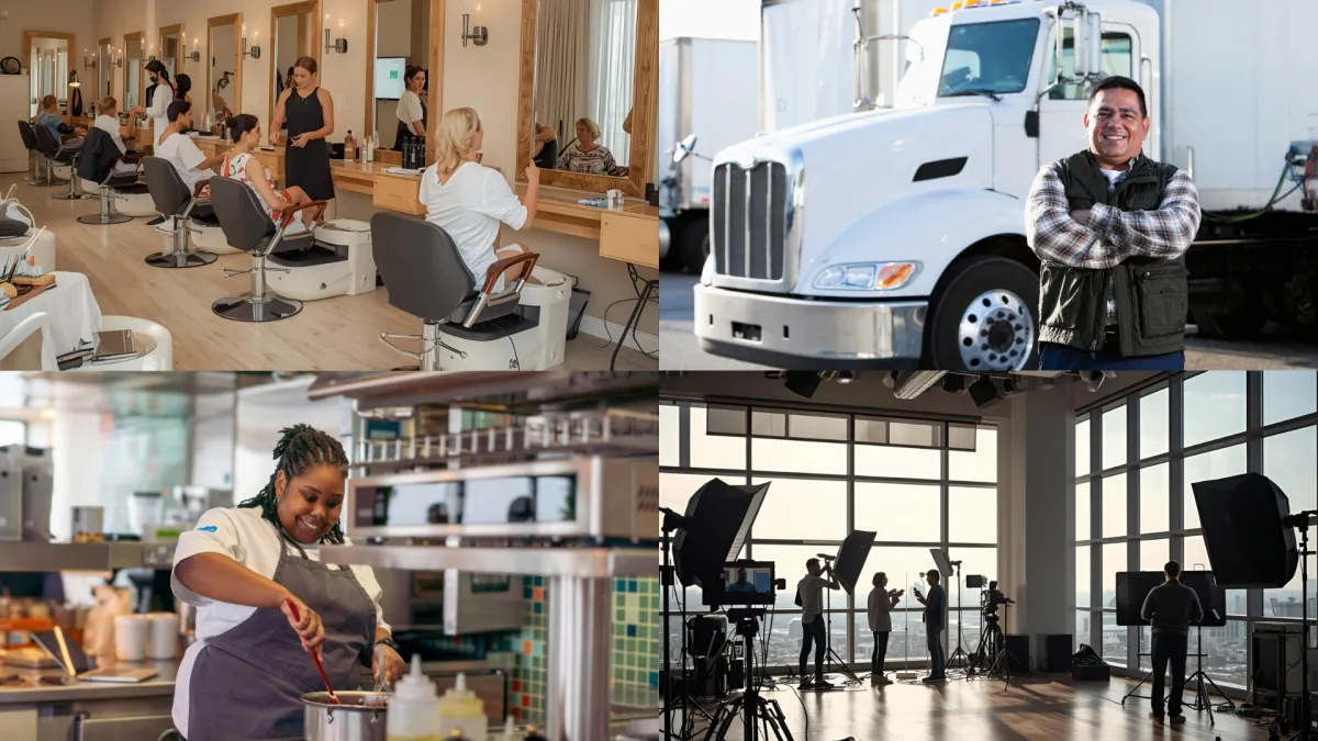 man in purple suit jacket using laptop computer