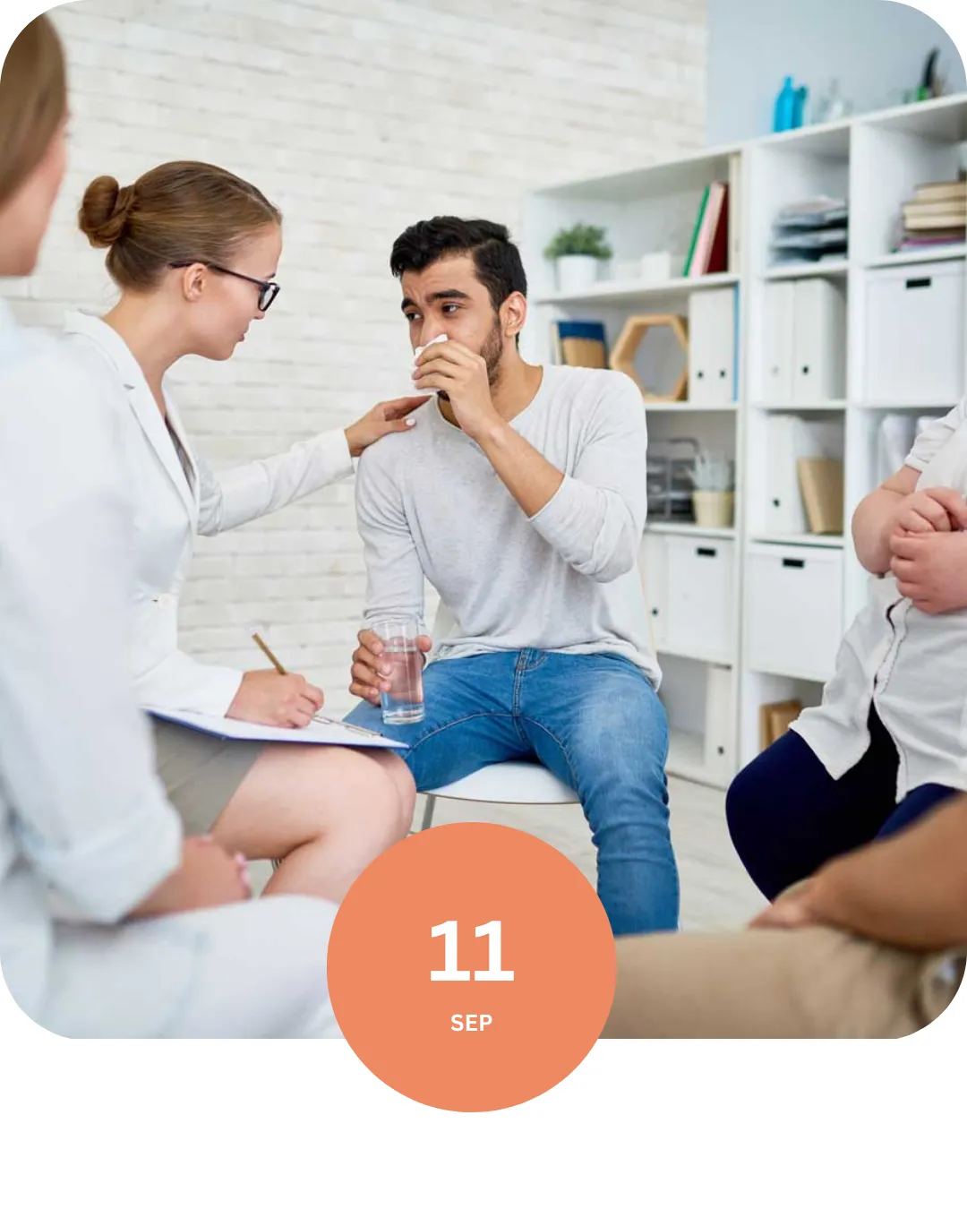 Clinician pointing to jaw anatomy on a TMJ diagram.