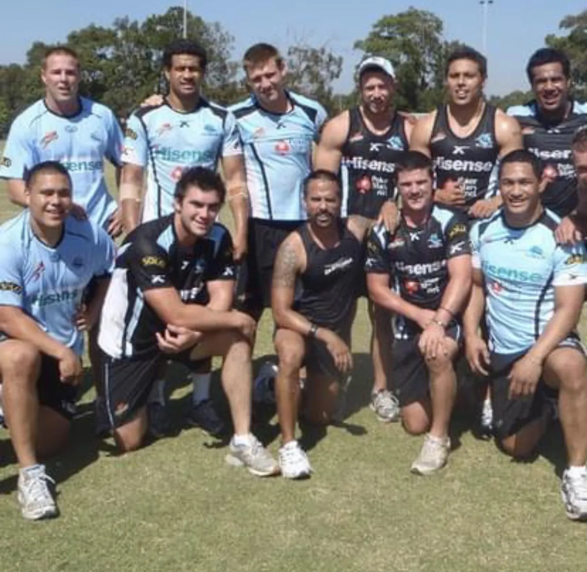 Nathan Helberg with Cronulla Sharks players in a group shot after training with ZUU Fitness.