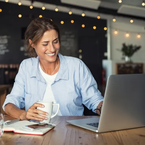 Happy woman working on her laptop
