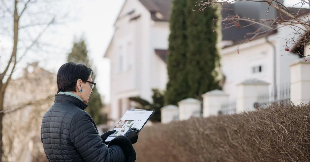Sober living home operator and local advisor reviewing a residential zoning map