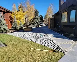 A modern paved driveway and walkway with geometric concrete slabs