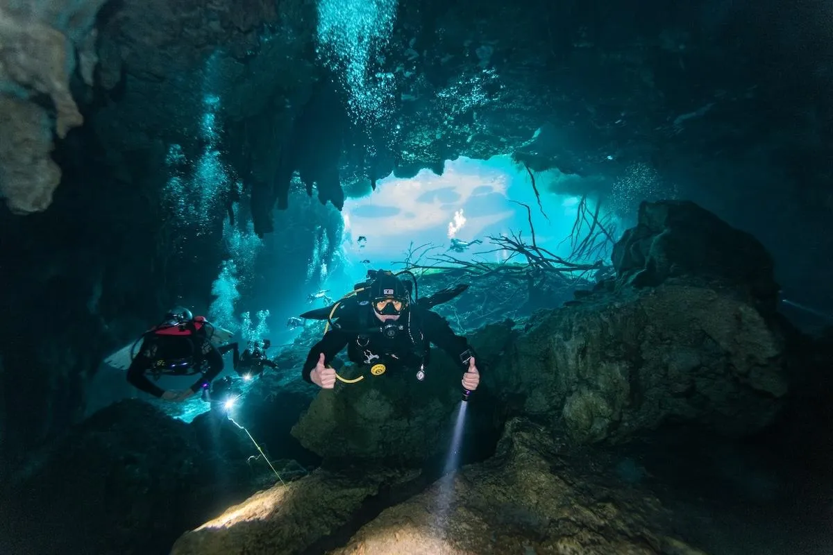 Divers entering the cavern section at Car Wash