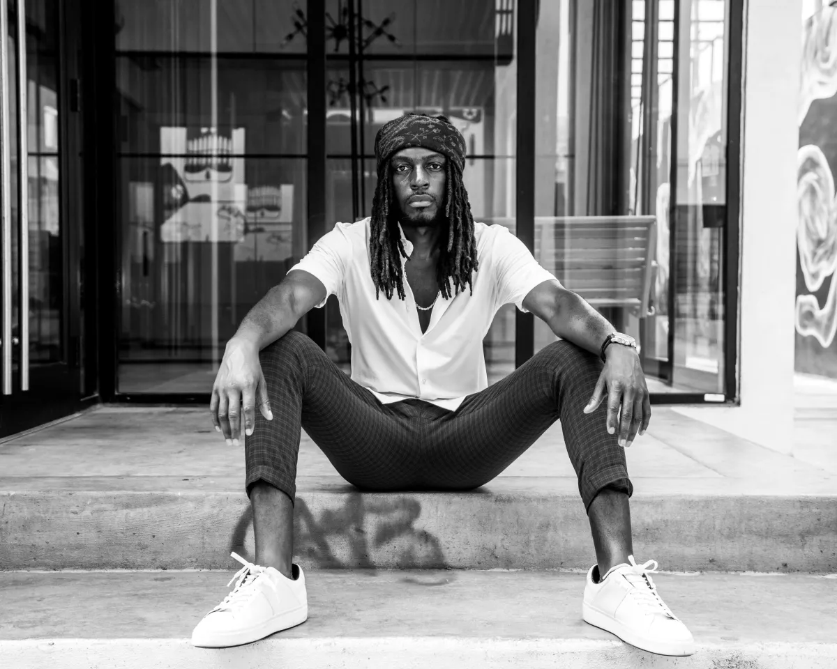 Modern AI-powered property auction dashboard interface with real-time analytics, digital gavel, and diverse users interacting on laptops and tablets. The background features abstract data visualizations in blue gradients, conveying innovation and efficiency.