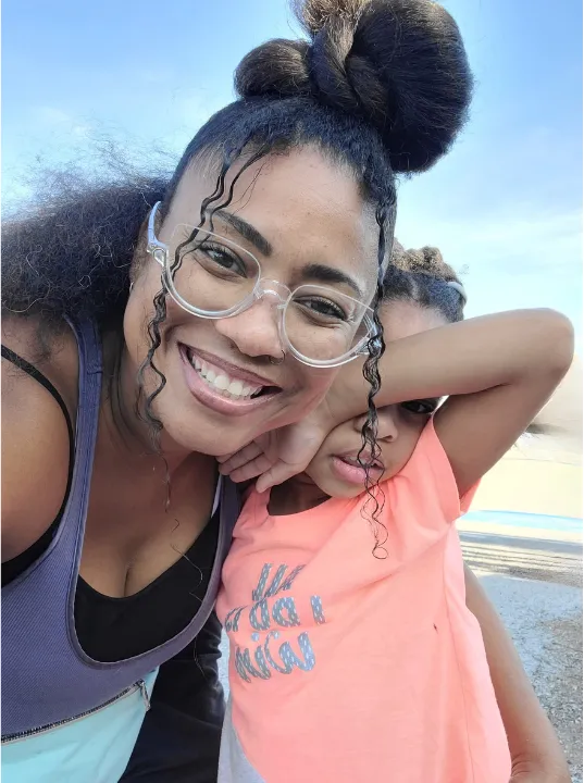 Picture of  me, Já, at the beach with her youngest daughter