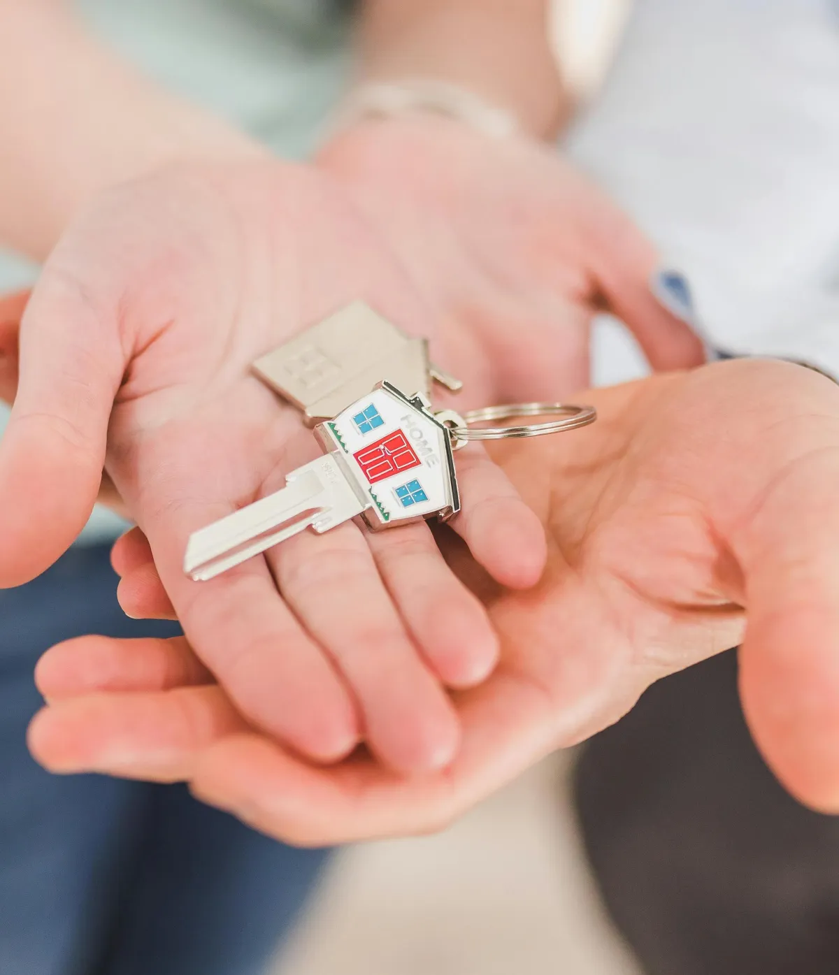 New homeowners receiving keys after qualifying for Lowtility’s down payment grant