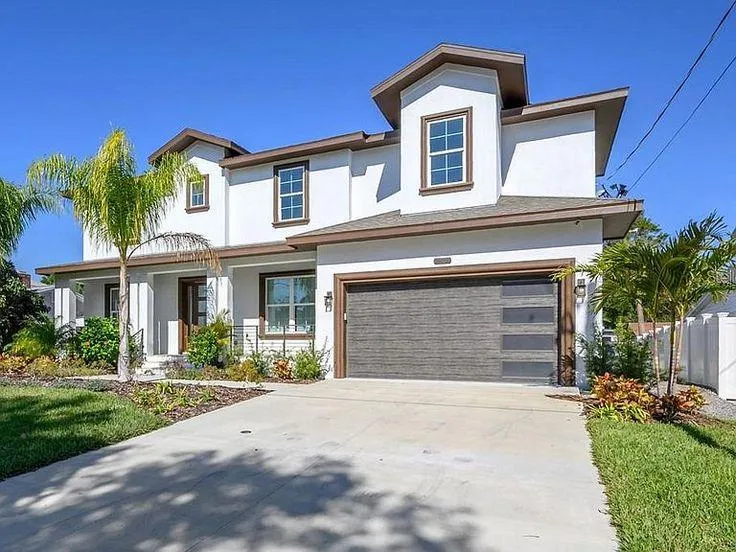 gray couch beside green potted plant