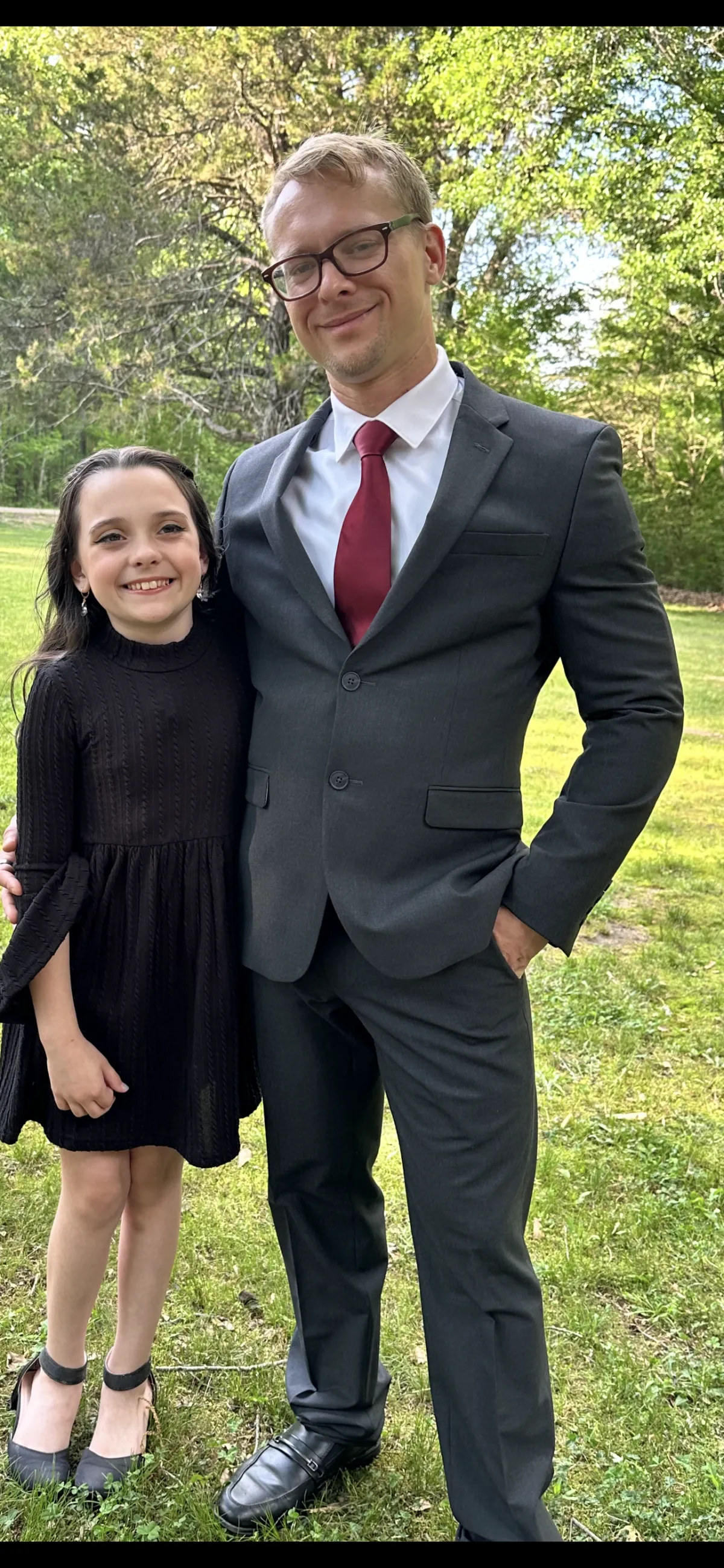 Father and daughter in sunny outdoors