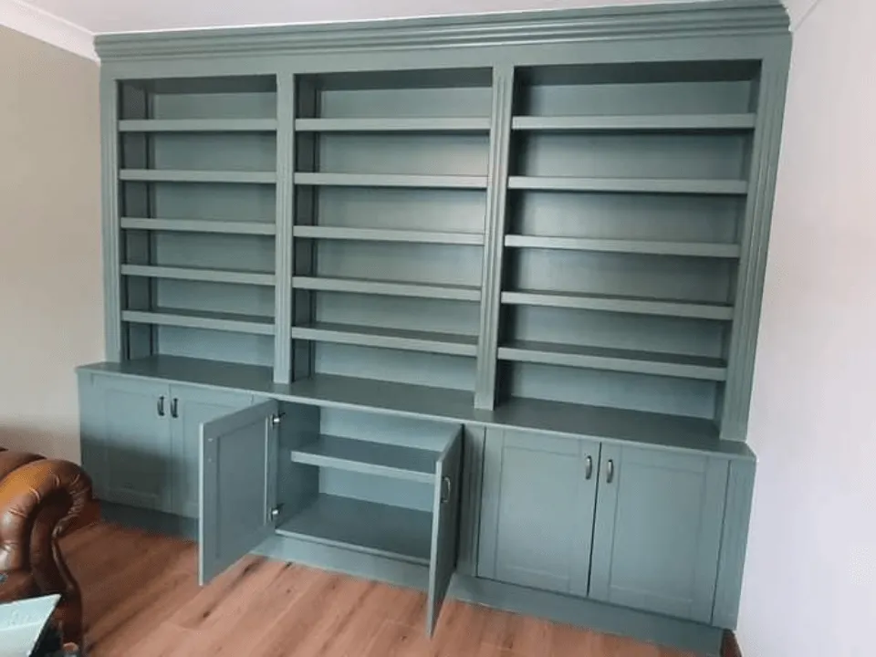  Photo of a built-in bookcase with bottom opening cupboards that our joiners designed