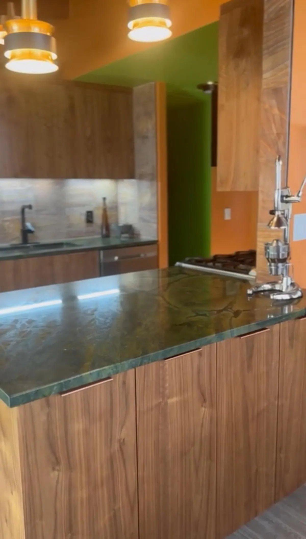Alpine bathroom project with a dark countertop and wood cabinetry
