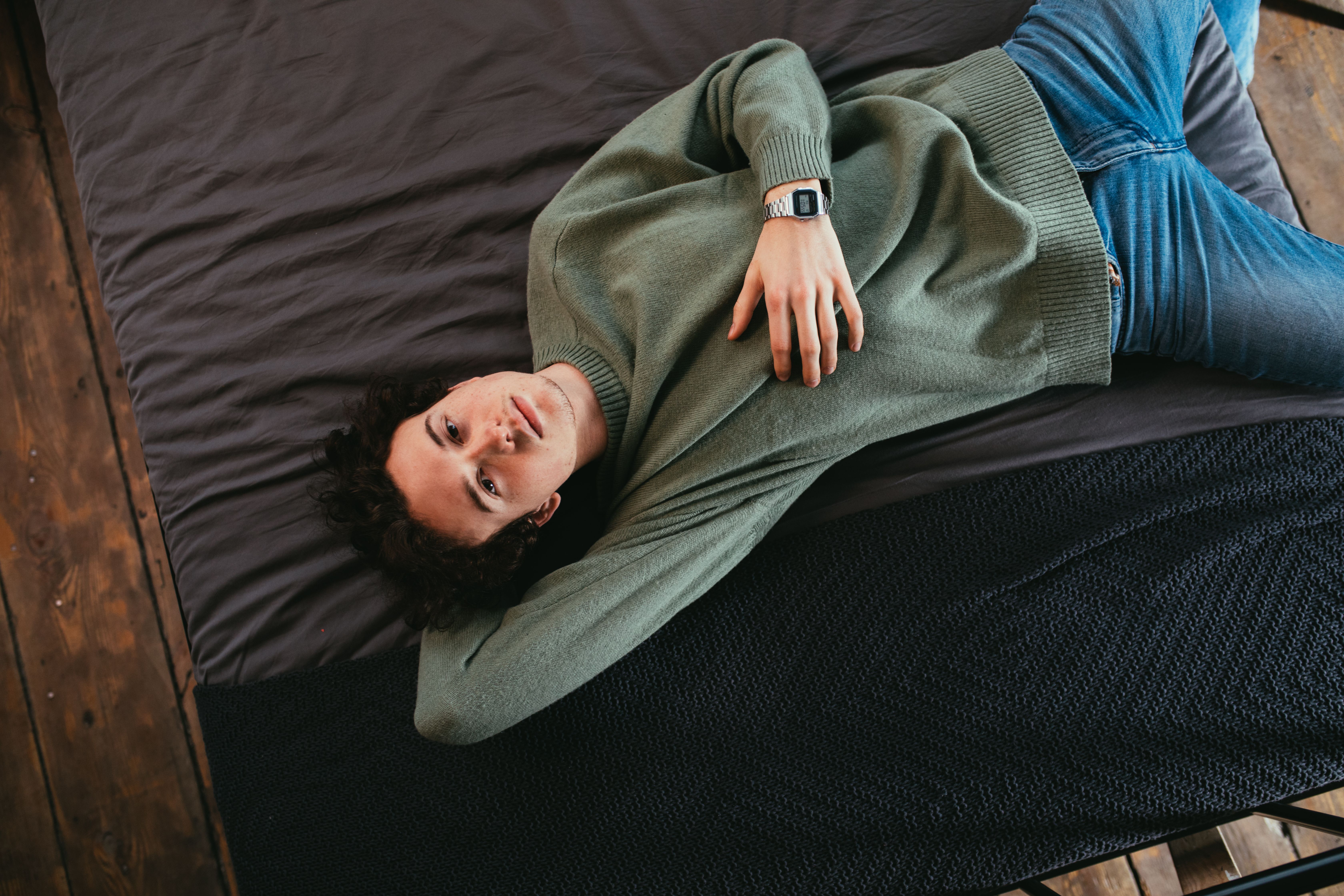 Person lying on bed
