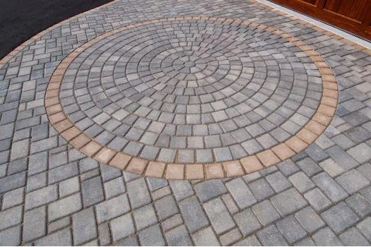 Circular paver patio with concentric design, demonstrating custom patio installation.